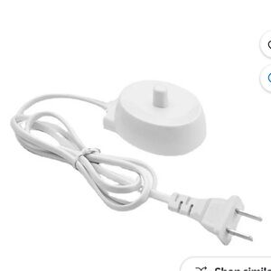 ORAL B electric toothbrush wall charger.  BRAND NEW